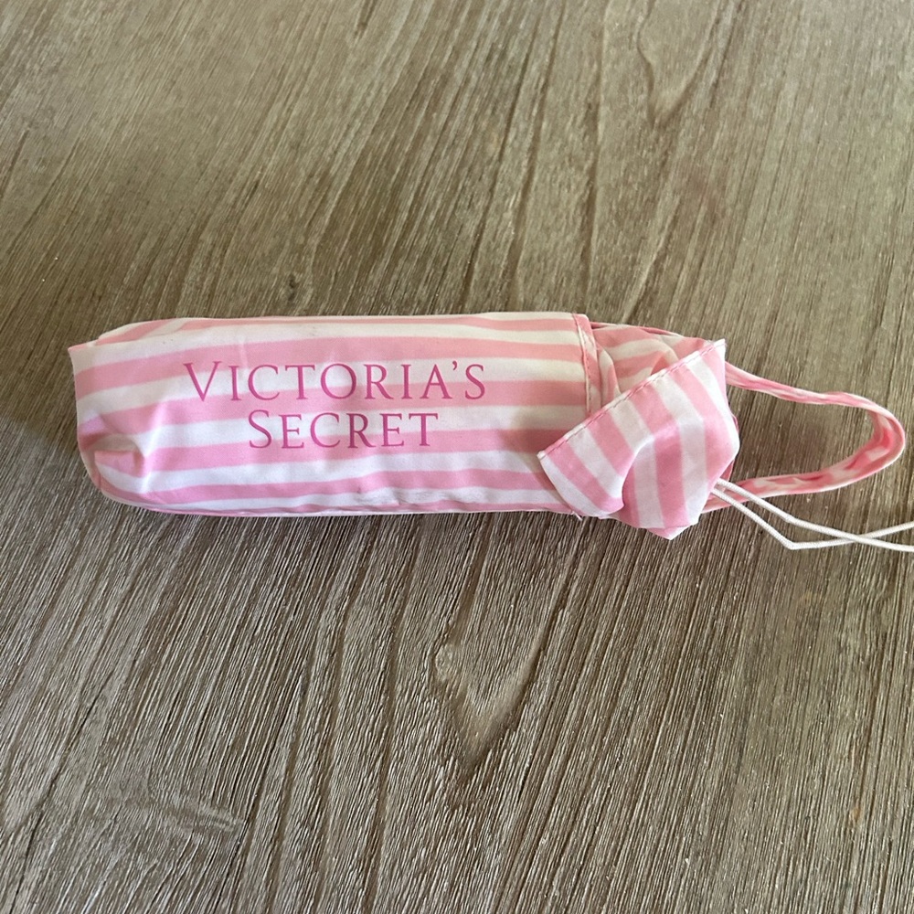 Vintage Victoria’s Secret iconic pink and white stripe umbrella.